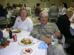 Cindy and Steve, with Isaiah - the star of the party