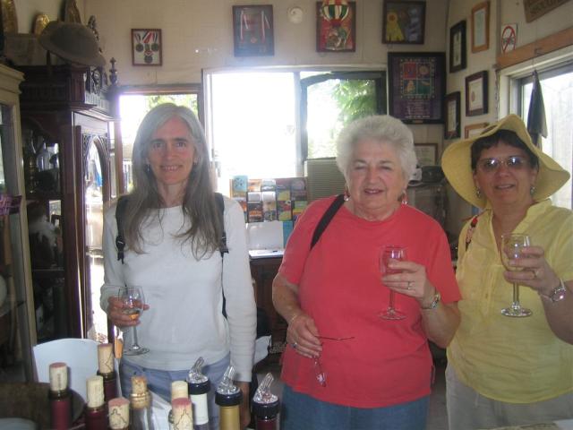 The three amigos tasting wine.