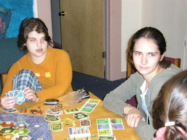 Natela and Kathy discussing trades with Jenna in Settlers