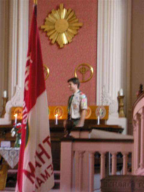 My cousin Bailey lighting candles at his Eagle ceremony