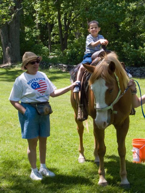 Zach riding a horse at Boylston's Memorial Day celebration