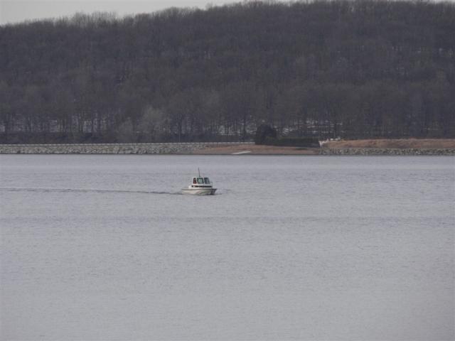 A rare sight-- a boat on the reservoir