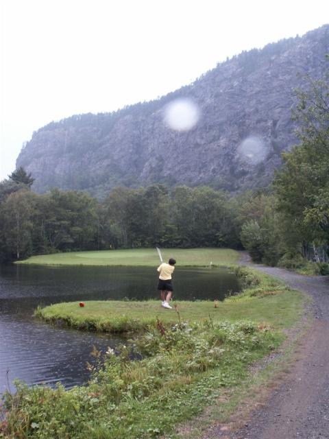 Anne tees off at Mt. Kineo