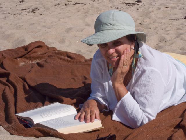 Anne reading at the beach