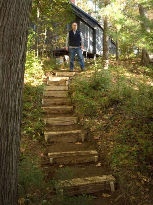 Jim and new steps running to the back of the boathouse.