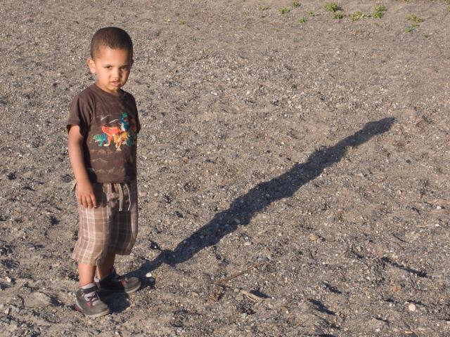 Isaiah on the beach at the reservoir