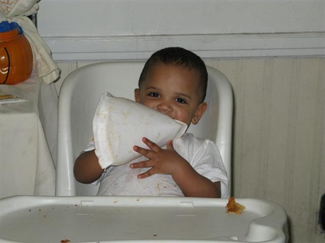 Isaiah is a human garbage disposal...even enjoying his plate!!!