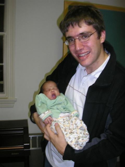 Me with Isaiah...the baby looks a bit tired by this point