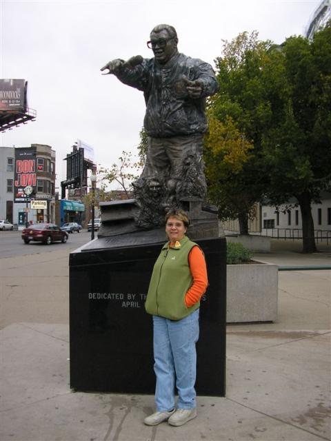 Mom under the creepy Harry Carrey statue