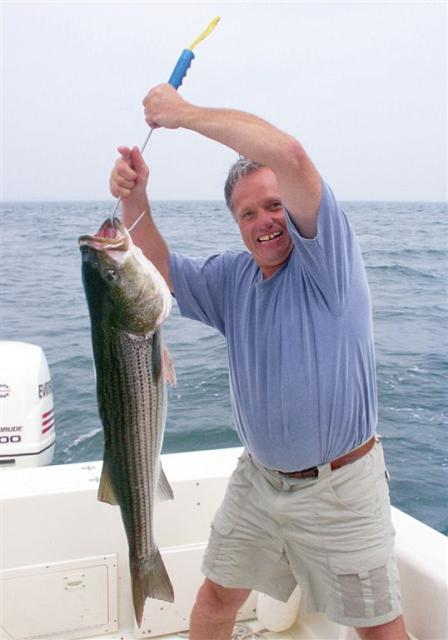 Arthur Gibree and big striper, Long Island Sound