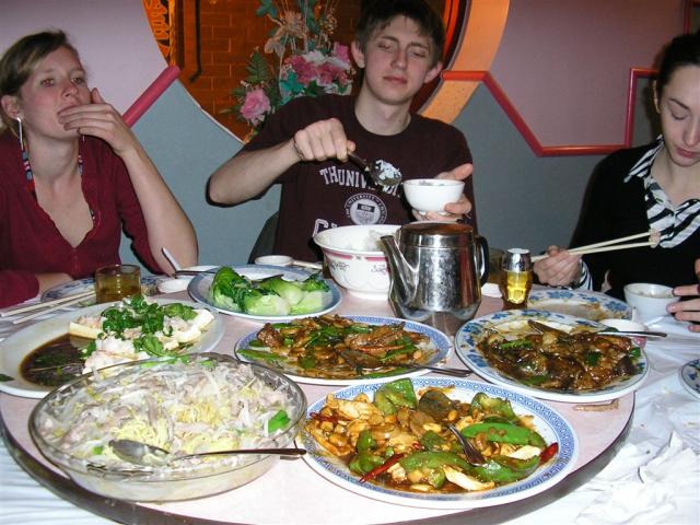 Janet, Serge, and Emily enjoying our massive piles of Chinese food