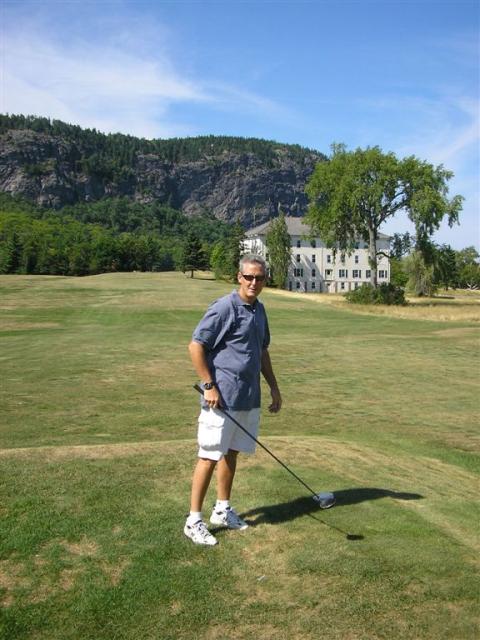 Mike teeing off on the ninth hole...anyone in the building on the right should look out!